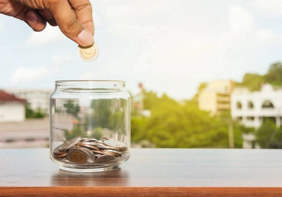 A man collecting money in a jar